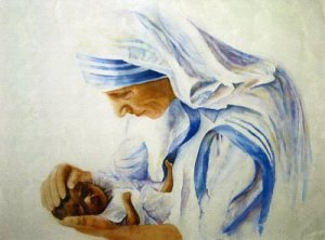 Mother Teresa Tenderly holding a Baby
